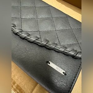 Brand new Roxy Wallet. Black leather.